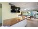 Fun recreation room featuring a billiards table, granite counter, and large-screen TV at 2711 N Halifax Ave # 890, Daytona Beach, FL 32118