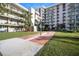 Well-maintained shuffleboard court surrounded by grassy areas, offering a recreational amenity for residents at 2711 N Halifax Ave # 890, Daytona Beach, FL 32118