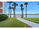 Path to waterfront pier offers scenic views with lush landscaping and serene water setting at 2711 N Halifax Ave # 890, Daytona Beach, FL 32118