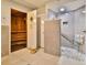 Modern bathroom featuring a sauna and a tiled shower with a seat at 2967 S Atlantic Ave # 1203, Daytona Beach Shores, FL 32118