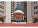 Condominium entrance with an awning that says Oceans Six Condominiums, as well as an American flag at 2967 S Atlantic Ave # 1203, Daytona Beach Shores, FL 32118