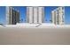 Beachfront condos featuring balconies, beach access, and clear blue skies at 2967 S Atlantic Ave # 1203, Daytona Beach Shores, FL 32118