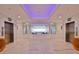 Lobby with dual elevators on either side of decorative display with ocean background at 2967 S Atlantic Ave # 1203, Daytona Beach Shores, FL 32118