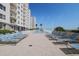 Resort-style pool deck with lounge chairs and beautiful beachfront at 2967 S Atlantic Ave # 1203, Daytona Beach Shores, FL 32118