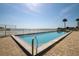 Outdoor pool with brick-laid deck and ocean views at 2967 S Atlantic Ave # 1203, Daytona Beach Shores, FL 32118