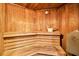 Inviting wooden sauna with tiered benches and a traditional bucket at 2967 S Atlantic Ave # 1203, Daytona Beach Shores, FL 32118