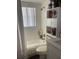 Bright bathroom with shower over tub and built-in storage at 301 Paradise Ln, Edgewater, FL 32132