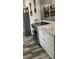 Contemporary kitchen features sleek appliances and white cabinets at 301 Paradise Ln, Edgewater, FL 32132