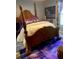 Spacious main bedroom features a decorative wood bed frame and stylish purple accents at 301 Paradise Ln, Edgewater, FL 32132