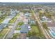 Residential area featuring a well-kept single-Gathering home with a long driveway, lush yard, and mature trees at 317 Oak Hill Dr, Altamonte Springs, FL 32701