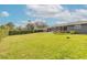 Beautiful backyard with lush lawn, mature trees, and well-maintained landscaping at 317 Oak Hill Dr, Altamonte Springs, FL 32701