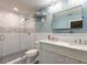Elegant bathroom with a glass-enclosed shower, dual sinks, marble countertops and tiled floors at 317 Oak Hill Dr, Altamonte Springs, FL 32701
