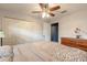 Comfortable bedroom with hardwood floors, closet and dresser; filled with natural light at 317 Oak Hill Dr, Altamonte Springs, FL 32701