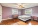 Airy bedroom features wood floors, lots of light, ceiling fan, and neutral colors at 317 Oak Hill Dr, Altamonte Springs, FL 32701