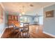 Charming dining room featuring hardwood floors, stylish pendant lighting, and an antique hutch at 317 Oak Hill Dr, Altamonte Springs, FL 32701