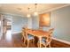 The dining room features a wood table with 4 chairs and hardwood floors at 317 Oak Hill Dr, Altamonte Springs, FL 32701