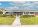 Charming single-story home with manicured landscaping and a welcoming entrance at 317 Oak Hill Dr, Altamonte Springs, FL 32701