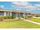 Inviting front entrance with a covered porch and decorative shrubs at 317 Oak Hill Dr, Altamonte Springs, FL 32701