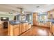 Eat-in kitchen includes a breakfast bar with granite counters, stainless vent hood, and window seating at 317 Oak Hill Dr, Altamonte Springs, FL 32701