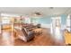 Open-concept living area with hardwood floors and an open view to the kitchen at 317 Oak Hill Dr, Altamonte Springs, FL 32701
