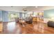 Open-concept living room with hardwood floors and abundant natural light at 317 Oak Hill Dr, Altamonte Springs, FL 32701