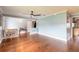 Open-concept living room with hardwood floors and blue accent walls at 317 Oak Hill Dr, Altamonte Springs, FL 32701