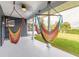 Covered back porch featuring colorful hammocks for relaxing and enjoying the outdoors at 317 Oak Hill Dr, Altamonte Springs, FL 32701