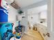 Bright storage and bathroom space with white cabinets, marble countertops, and shelving at 3700 S Atlantic Ave # 111, New Smyrna Beach, FL 32169