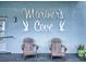 Mariner's Cove entrance with Adirondack chairs at 3700 S Atlantic Ave # 111, New Smyrna Beach, FL 32169