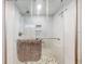 Updated glass shower featuring mosaic tile, dual shower heads, and a grab bar at 3700 S Atlantic Ave # 111, New Smyrna Beach, FL 32169