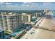 An aerial view of a beachfront condo, pier and pool with ocean views at 3703 S Atlantic Ave # 507, Daytona Beach Shores, FL 32118