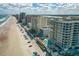 An aerial view of a beachfront community and pool with direct access to the beach at 3703 S Atlantic Ave # 507, Daytona Beach Shores, FL 32118