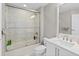 Modern bathroom features a sleek vanity, stylish mirror, and a glass-enclosed shower-tub combination with tiled walls at 3703 S Atlantic Ave # 507, Daytona Beach Shores, FL 32118