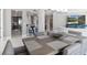 Spacious dining room with modern table settings open to the living room and kitchen at 3703 S Atlantic Ave # 507, Daytona Beach Shores, FL 32118