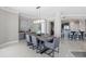 Elegant dining room area open to the kitchen features modern decor and wet bar at 3703 S Atlantic Ave # 507, Daytona Beach Shores, FL 32118