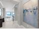 Hallway with artwork that leads to a living area with ocean view at 3703 S Atlantic Ave # 507, Daytona Beach Shores, FL 32118