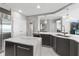 Bright kitchen featuring a large island, wine cooler, modern appliances and seamless flow into other living areas at 3703 S Atlantic Ave # 507, Daytona Beach Shores, FL 32118