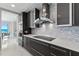 Modern kitchen features stainless steel appliances, sleek backsplash, and ample counter space at 3703 S Atlantic Ave # 507, Daytona Beach Shores, FL 32118