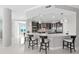 Beautifully appointed kitchen features an eat-in island, pendant lights, and modern appliances perfect for entertaining at 3703 S Atlantic Ave # 507, Daytona Beach Shores, FL 32118