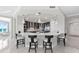 Spacious kitchen with counter seating, pendant lighting, and stainless steel appliances is a chef's delight at 3703 S Atlantic Ave # 507, Daytona Beach Shores, FL 32118