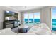 Bright living room features ocean views, sleek furnishings, and modern entertainment center at 3703 S Atlantic Ave # 507, Daytona Beach Shores, FL 32118
