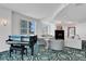 Cozy lounge space with fireplace, piano, and comfortable seating at 3703 S Atlantic Ave # 507, Daytona Beach Shores, FL 32118