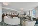 Expansive lounge with various seating areas, ocean view, and bar at 3703 S Atlantic Ave # 507, Daytona Beach Shores, FL 32118
