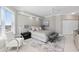Tastefully decorated bedroom with accent chair, modern lighting, and sleek ceiling fan at 3703 S Atlantic Ave # 507, Daytona Beach Shores, FL 32118