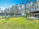 Expansive backyard showcasing a playground, fencing, and serene tree line, ideal for outdoor activities at 4252 Quail Ranch Rd, New Smyrna Beach, FL 32168