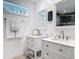 Bathroom featuring double sink vanities with quartz counters and framed mirrors at 4252 Quail Ranch Rd, New Smyrna Beach, FL 32168