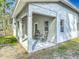 Cozy covered patio featuring an outdoor seating area, perfect for relaxing and enjoying the outdoors at 4252 Quail Ranch Rd, New Smyrna Beach, FL 32168