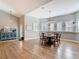Bright dining room with a round table, multiple windows, and stylish decor at 4252 Quail Ranch Rd, New Smyrna Beach, FL 32168