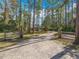 Scenic driveway leading to a secluded home surrounded by tall trees and lush landscaping at 4252 Quail Ranch Rd, New Smyrna Beach, FL 32168
