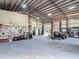 Well-lit and organized garage interior with workbench, tool storage, and plenty of space for vehicles at 4252 Quail Ranch Rd, New Smyrna Beach, FL 32168